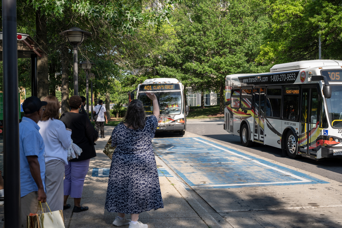 Waving to Approaching Bus