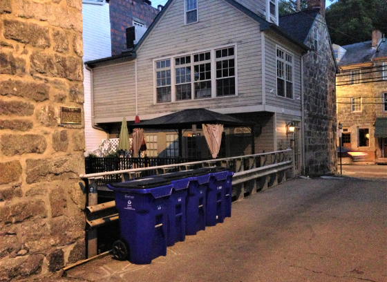 recycling carts against stone wall in historic ellicott city