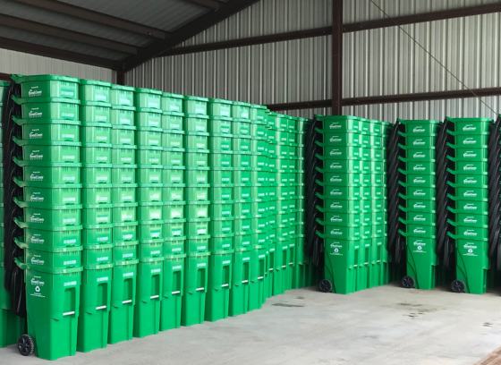 warehouse with many stacks of nested green carts