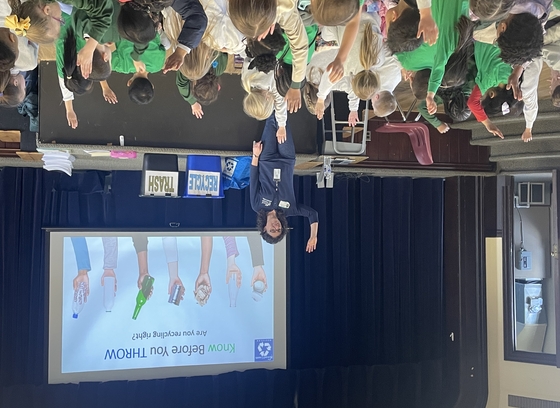 recycling coordinator presenting to group of children