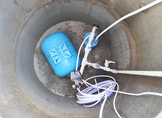 Water pump at the bottom of a concrete hole.